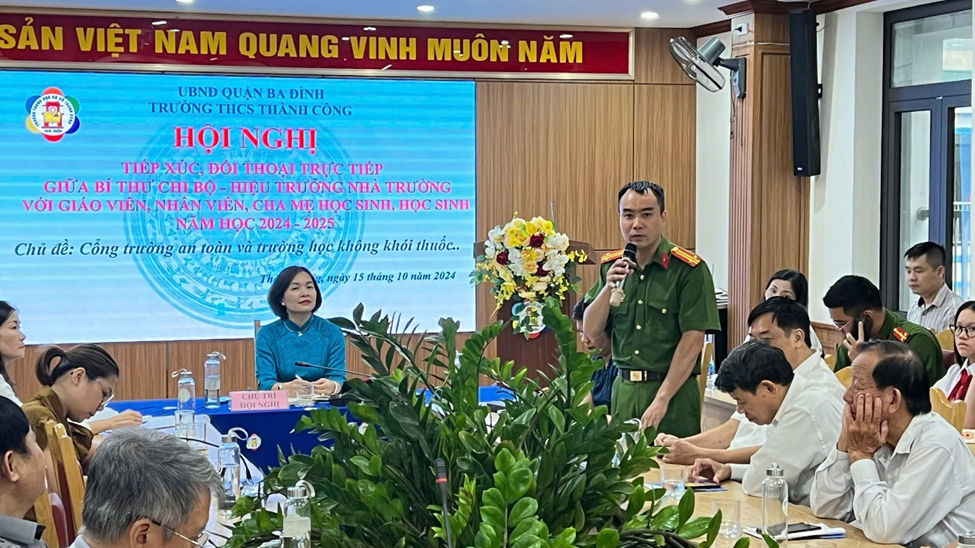 A person in uniform speaking into a microphone

Description automatically generated