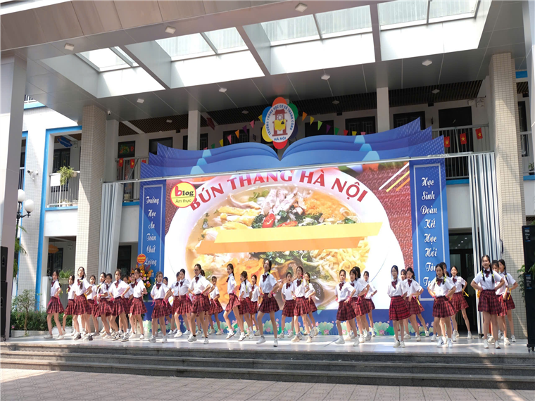 A group of women dancing on a stage

Description automatically generated