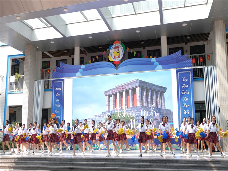 A group of girls dancing on stage

Description automatically generated
