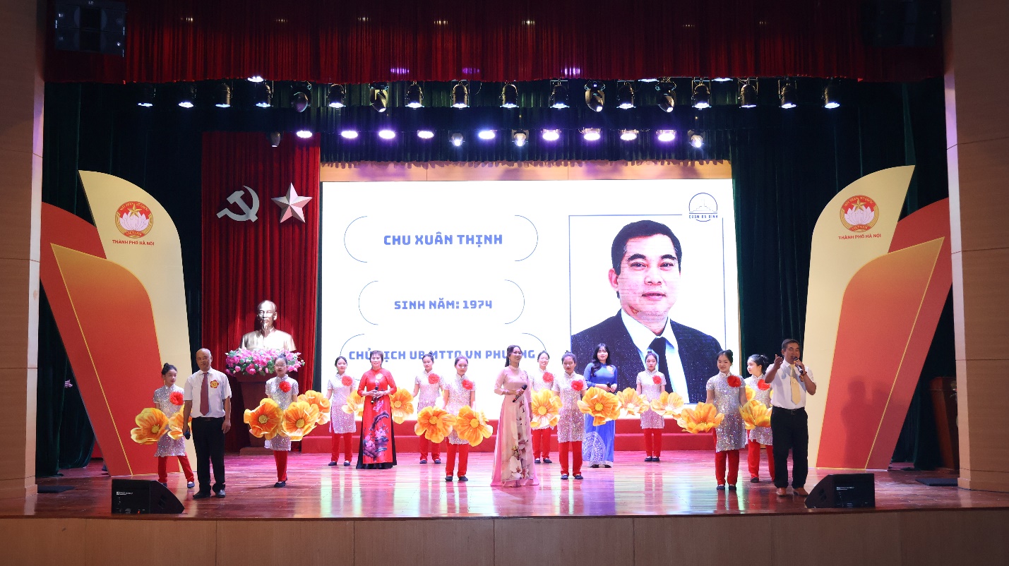A group of people performing on stage

Description automatically generated