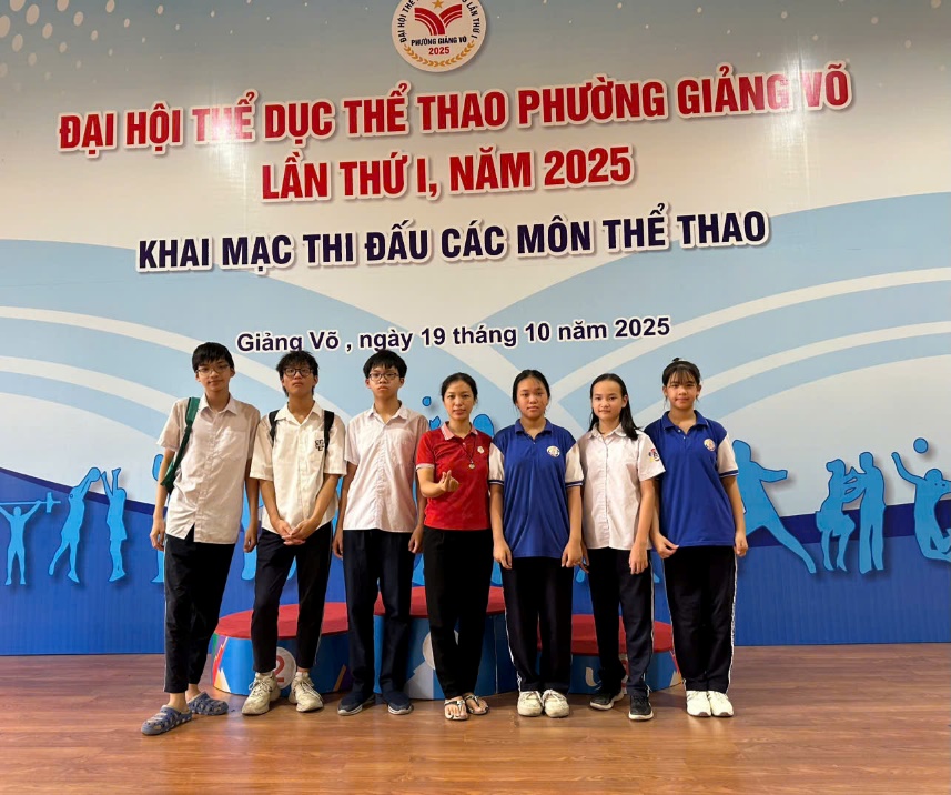 A group of people posing for a photo

Description automatically generated