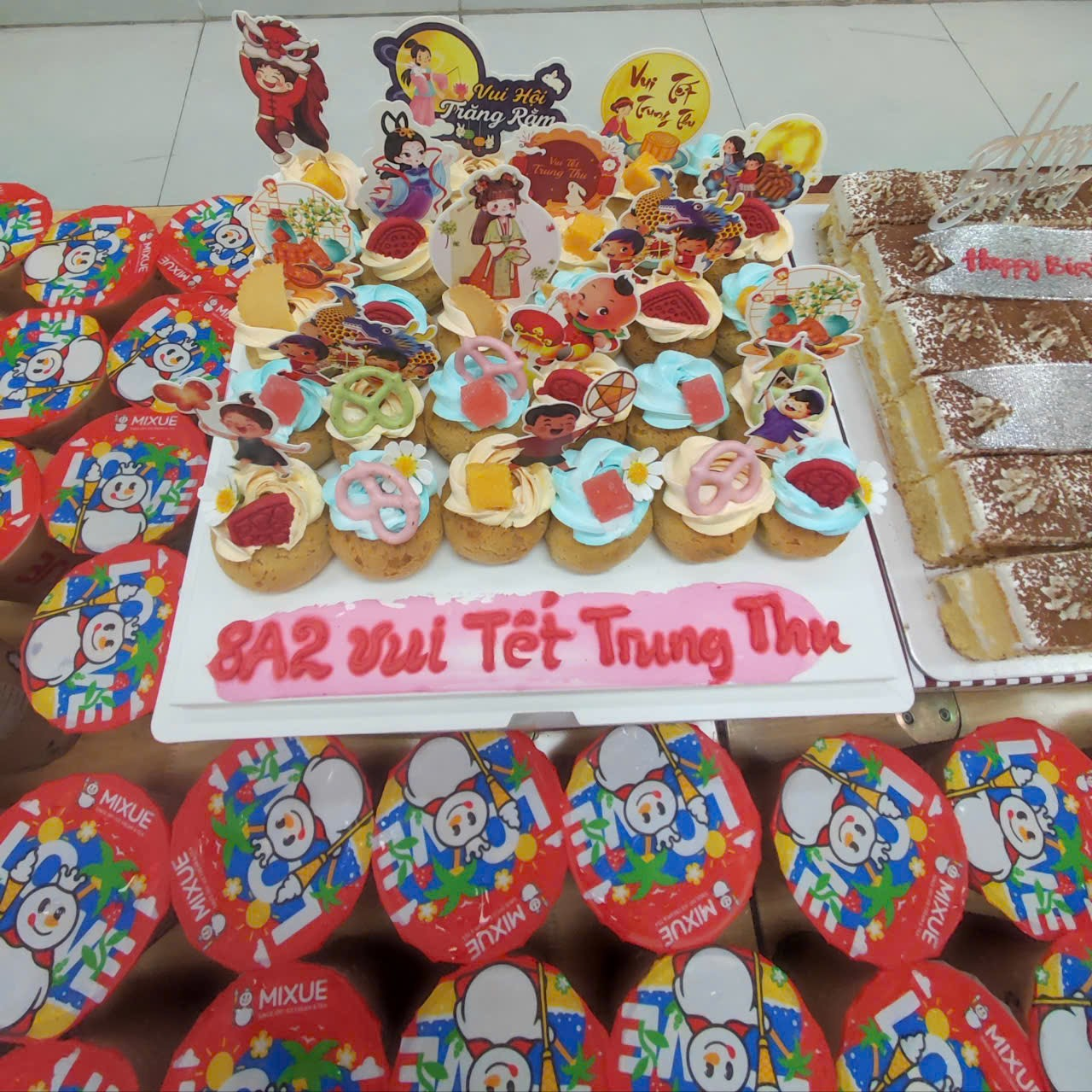 A table with different cakes

AI-generated content may be incorrect.