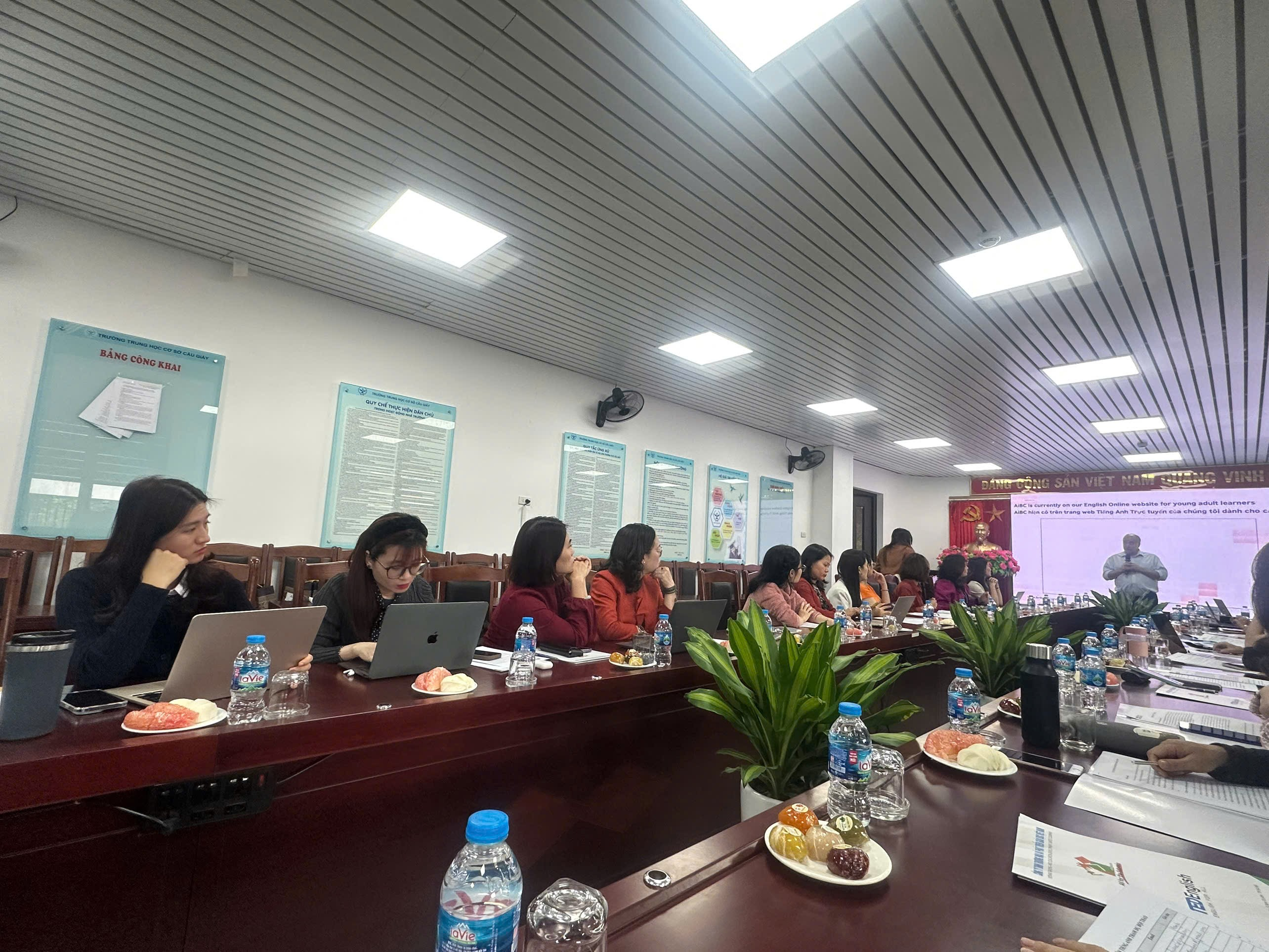 A group of people sitting at a table

Description automatically generated