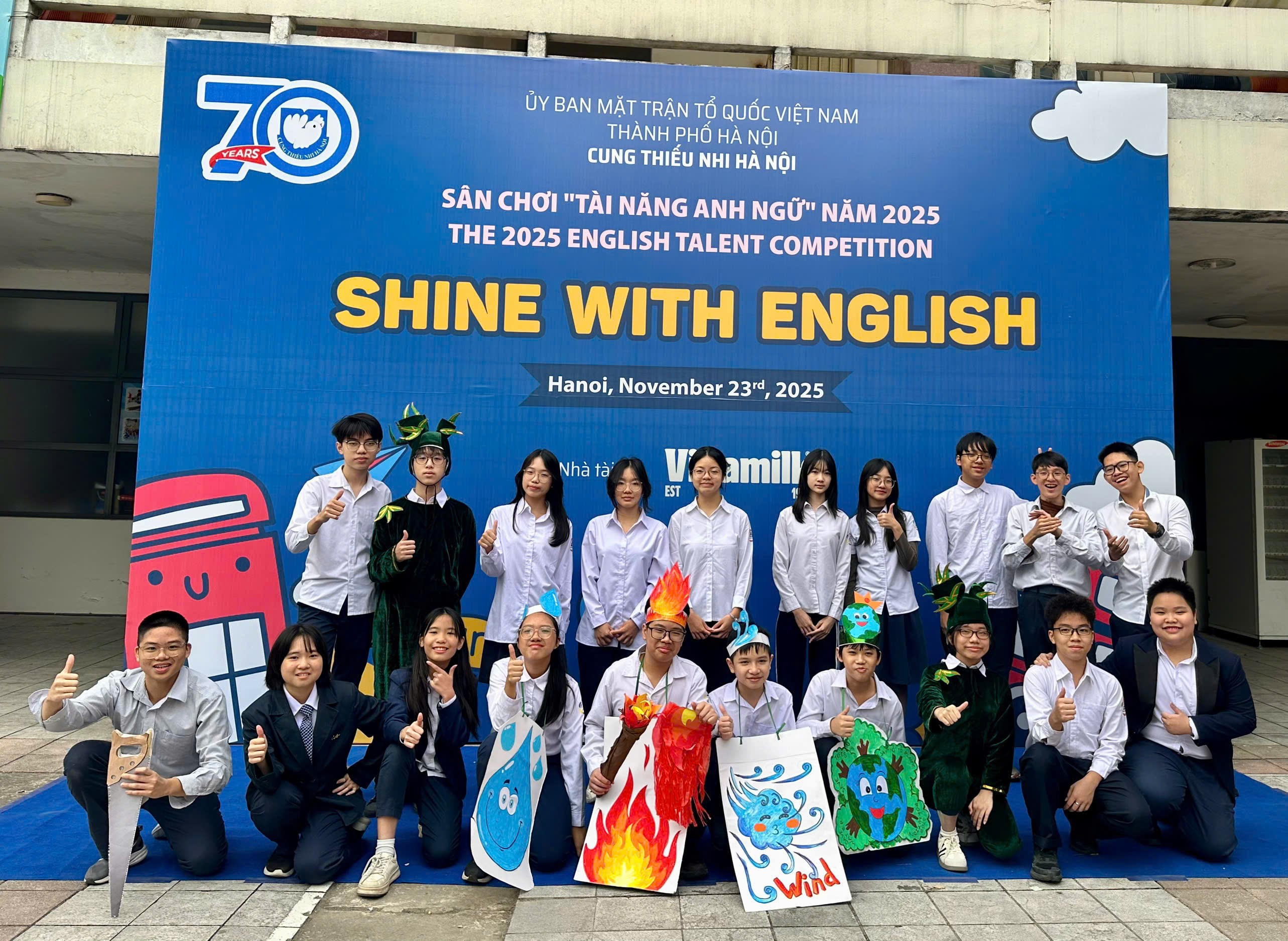 A group of people posing for a photo
Description automatically generated