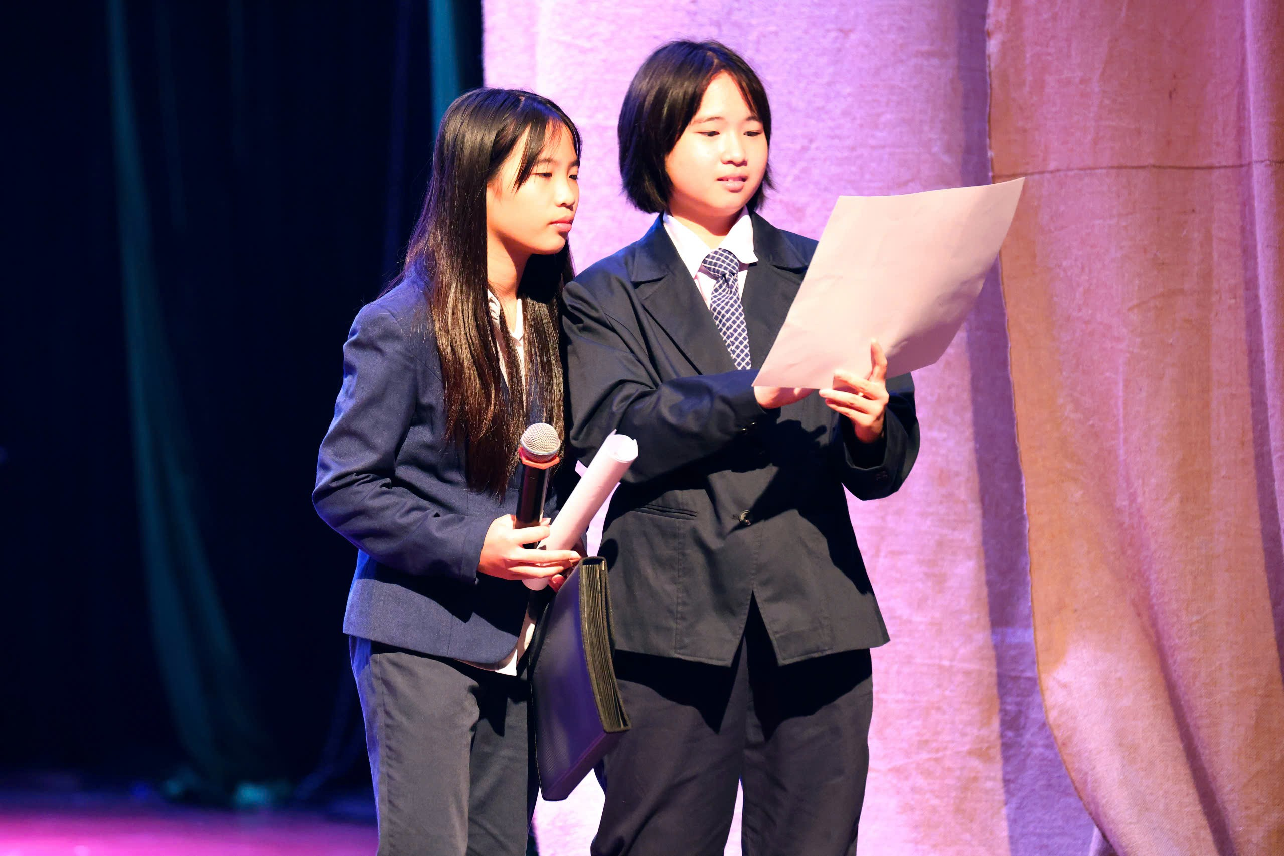 A couple of young women on stage
Description automatically generated