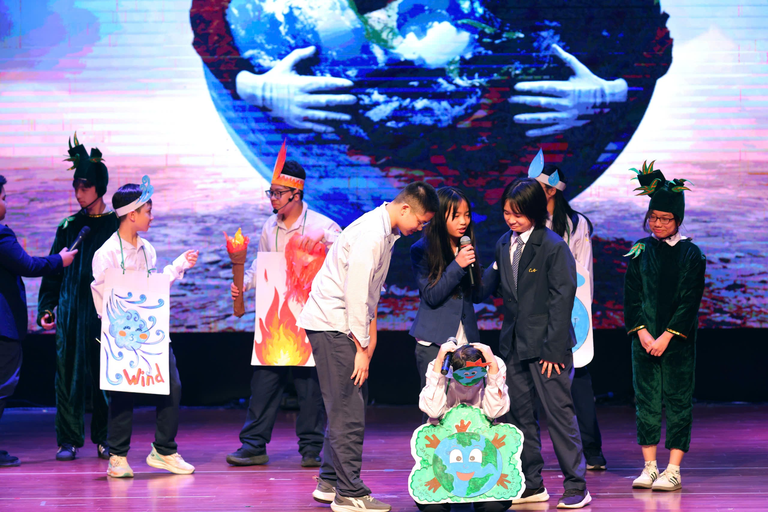 A group of people on a stage
Description automatically generated