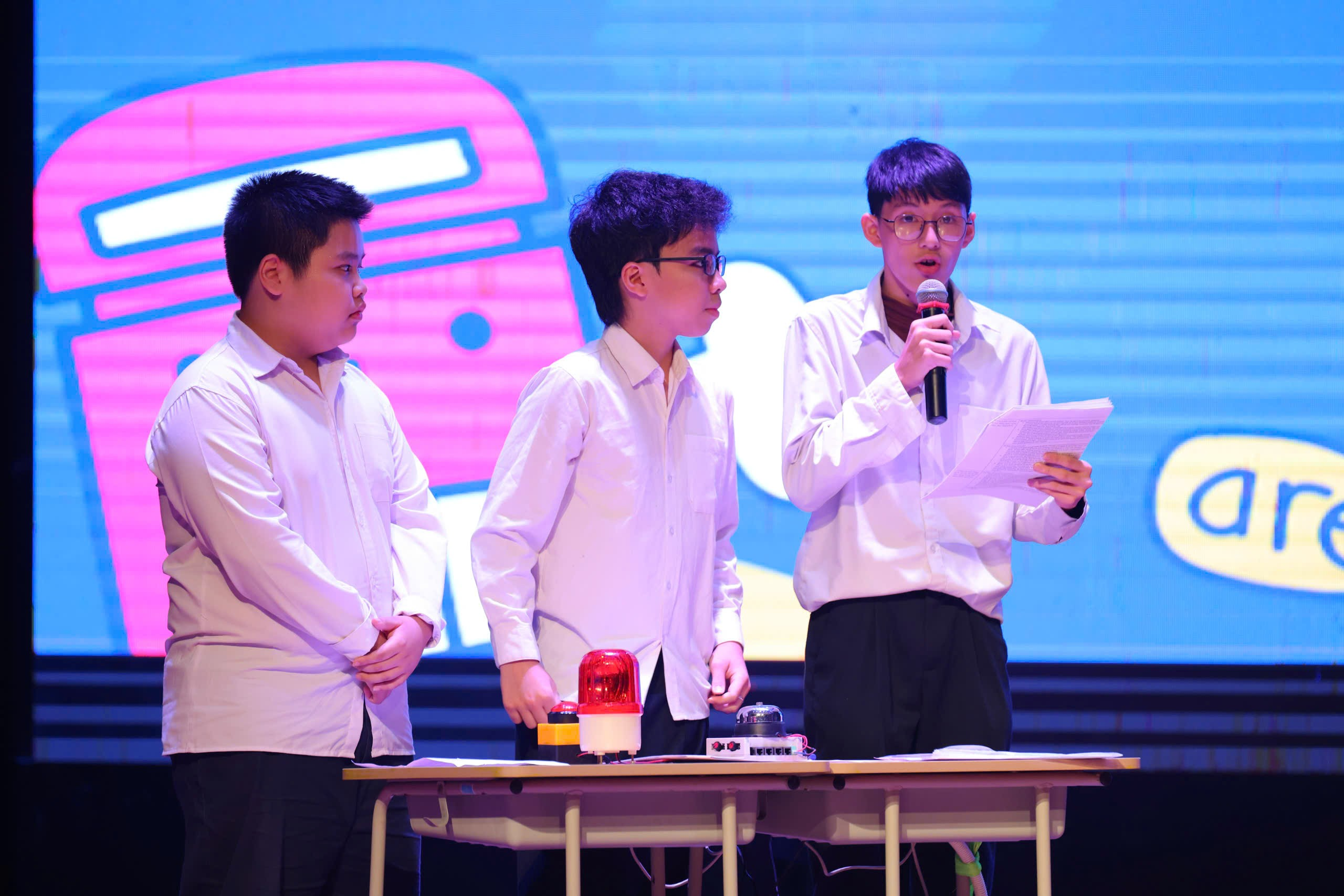 A group of boys standing on a stage
Description automatically generated