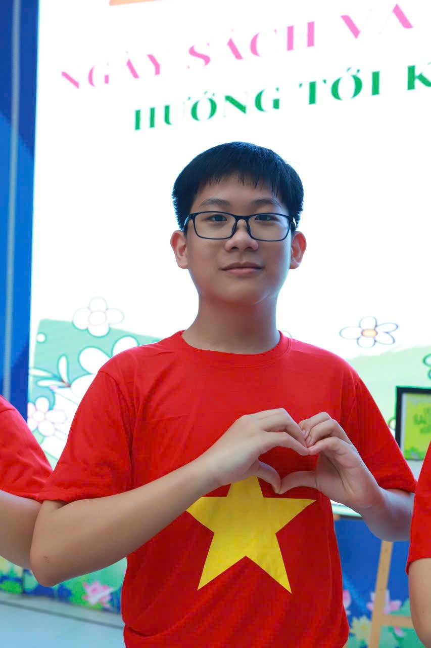 A child making a heart with his hands

AI-generated content may be incorrect.