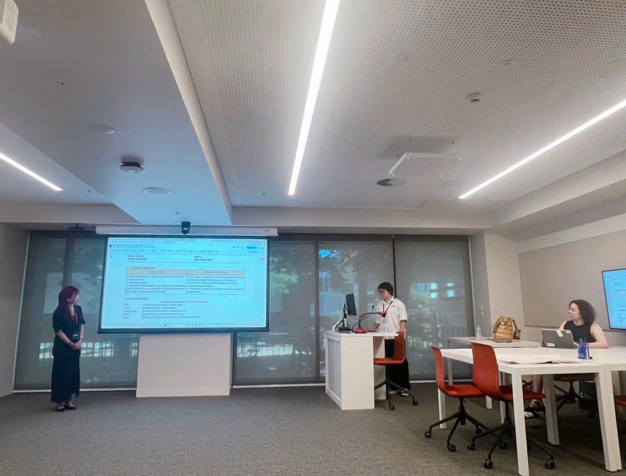 A person and person in a room
Description automatically generated