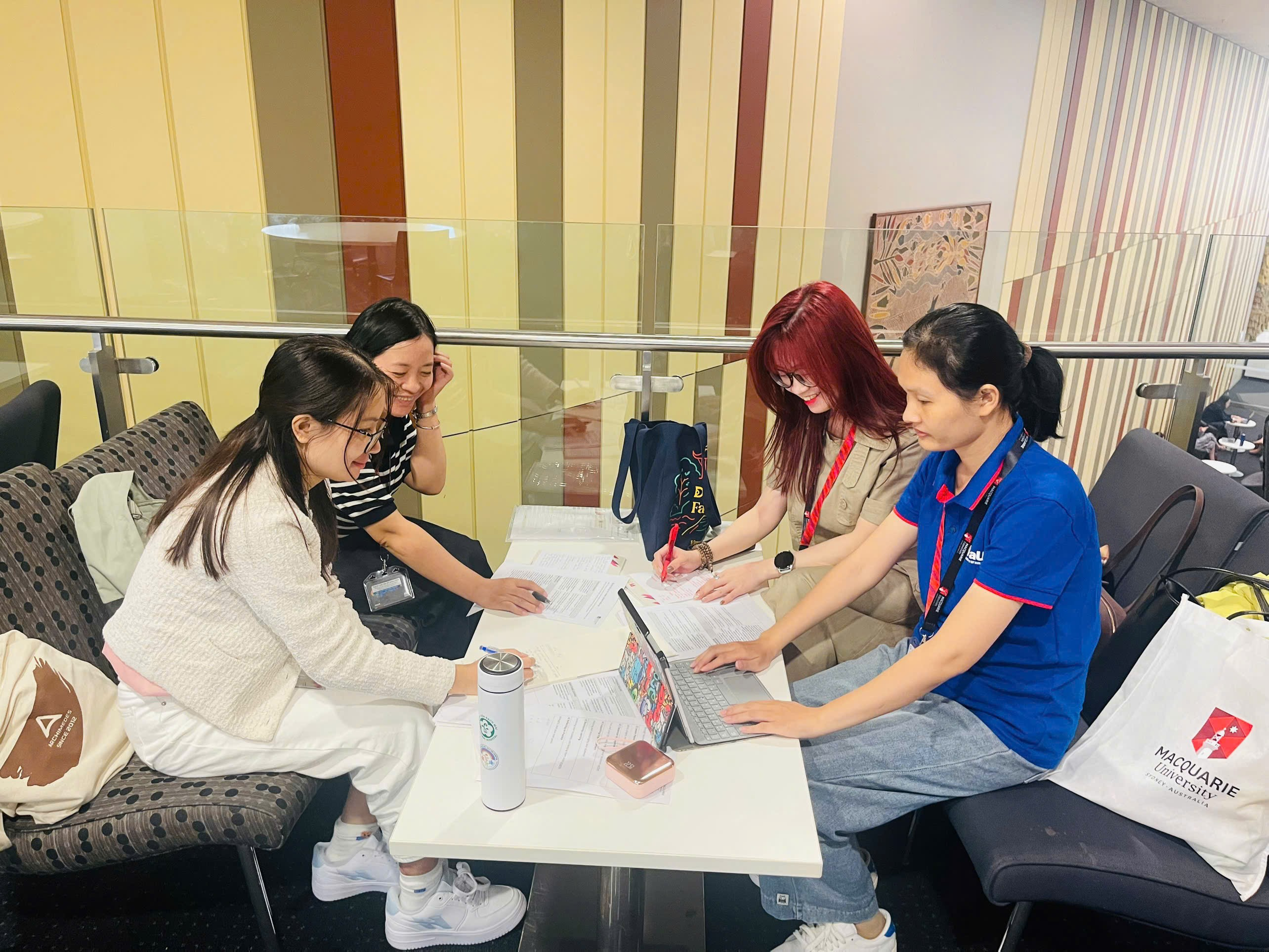 A group of women sitting at a table
Description automatically generated
