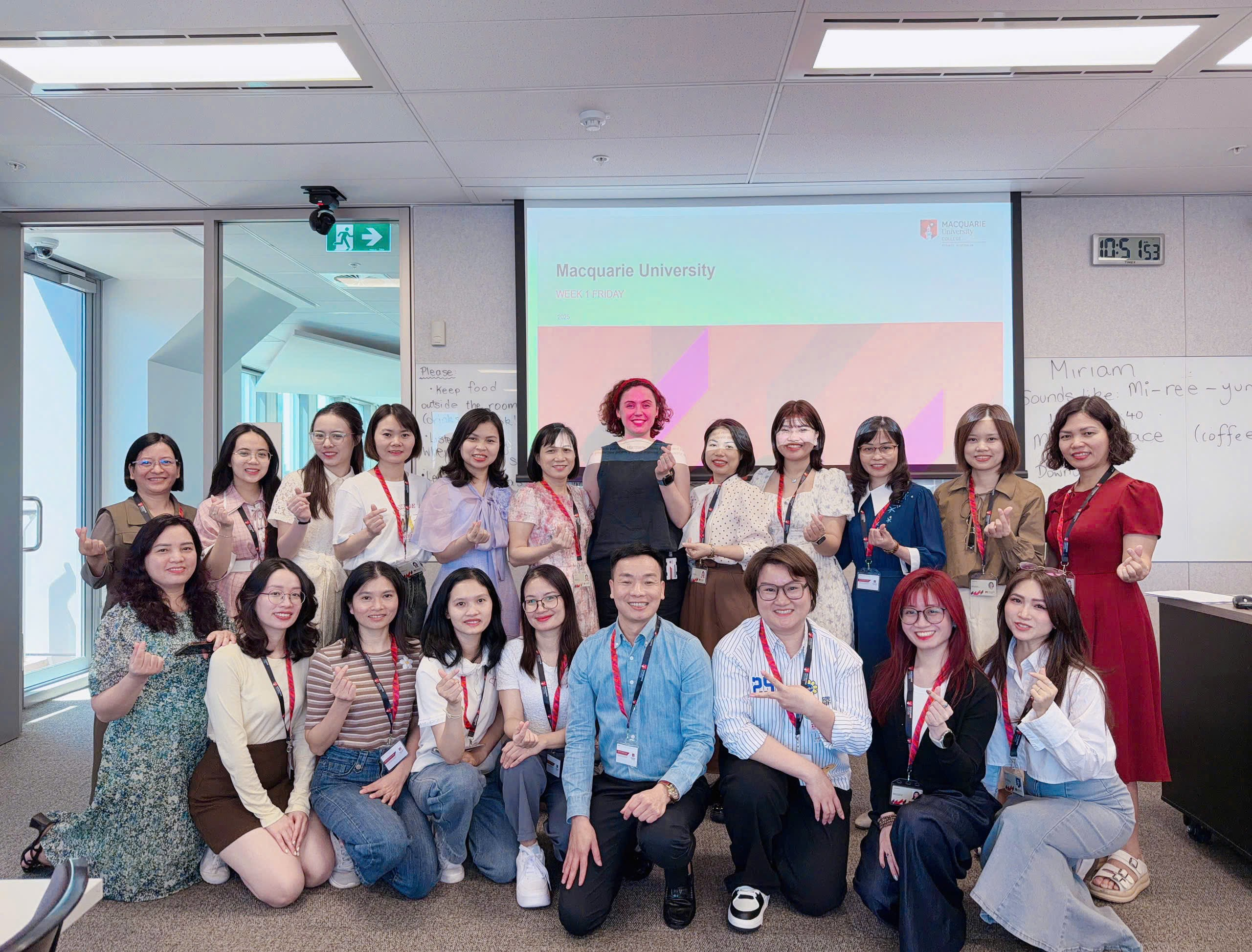 A group of people posing for a photo
Description automatically generated