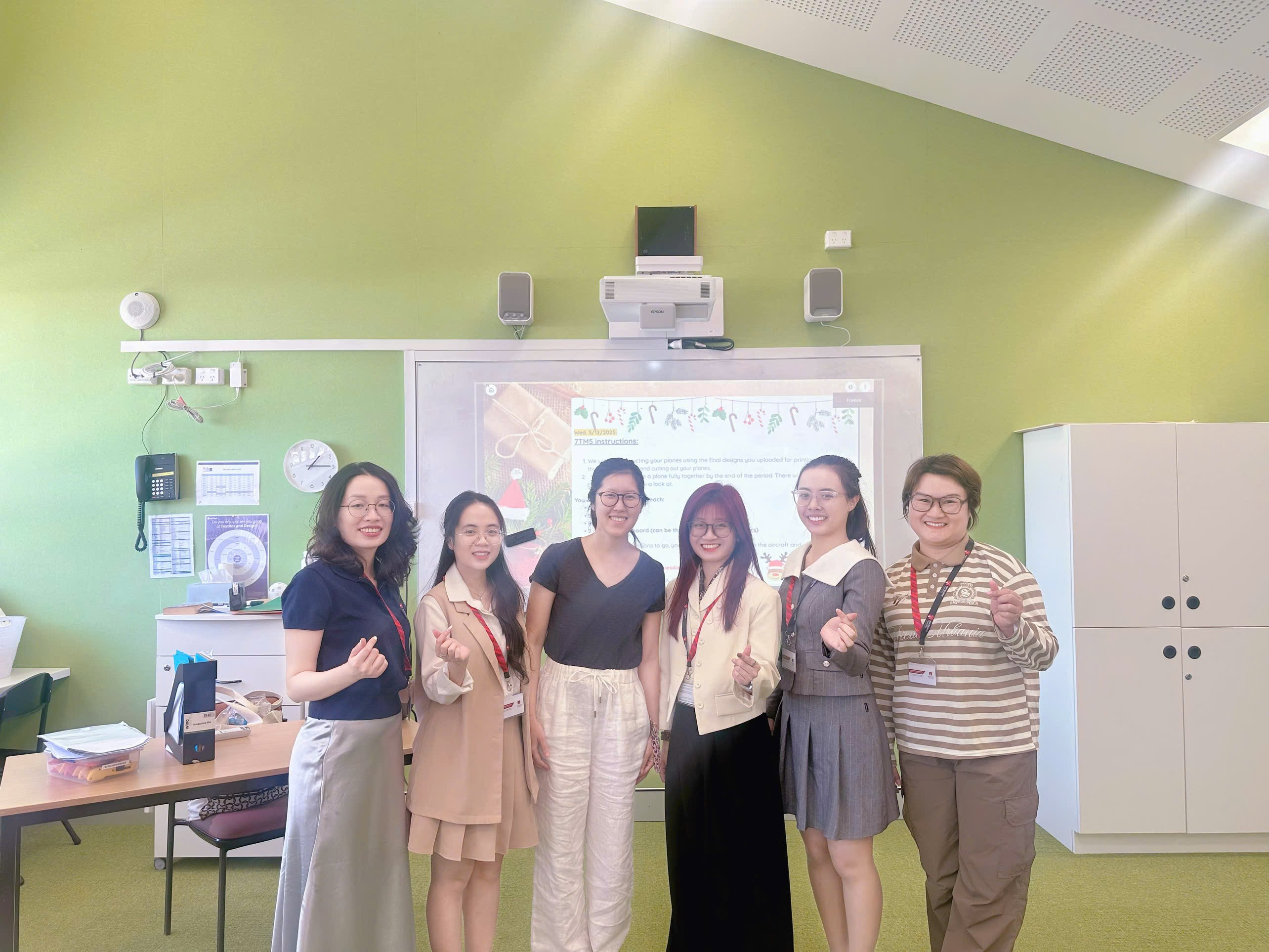 A group of people posing for a photo
Description automatically generated