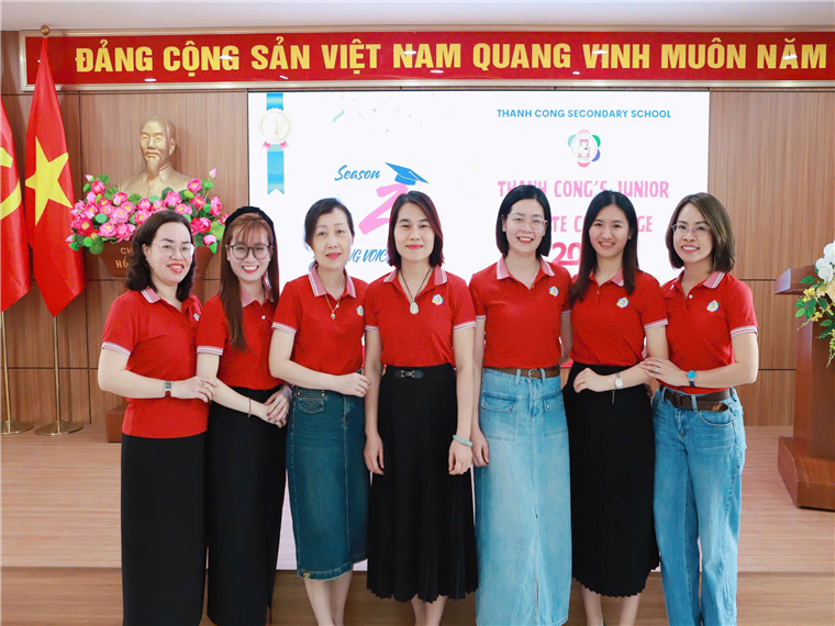 A group of women in red shirts

Description automatically generated