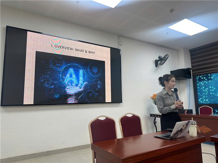 A person standing in front of a screen

Description automatically generated