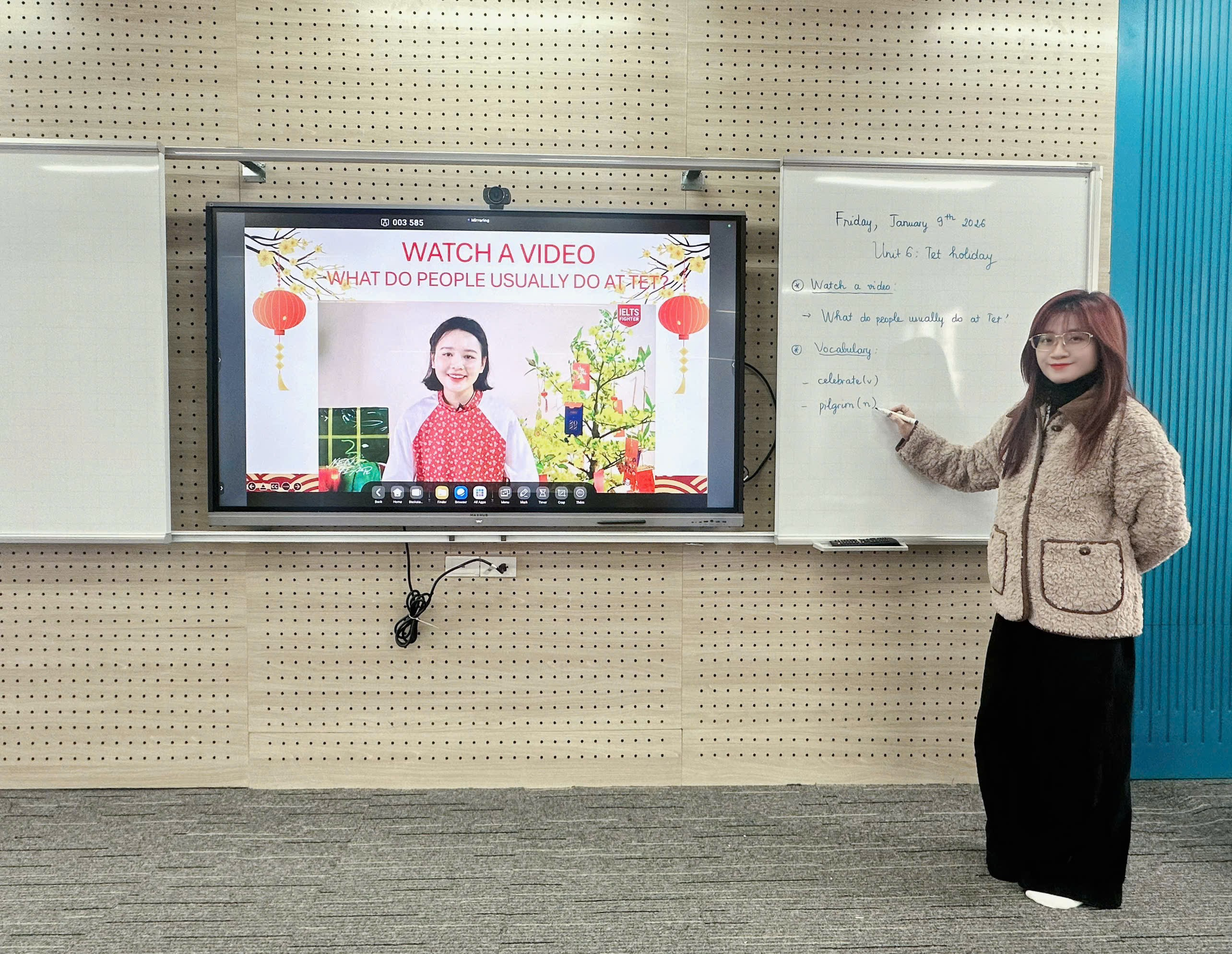 A person standing in front of a whiteboard

Description automatically generated