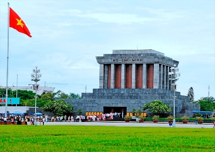 Ho Chi Minh Mausoleum with a flag in front of it

Description automatically generated