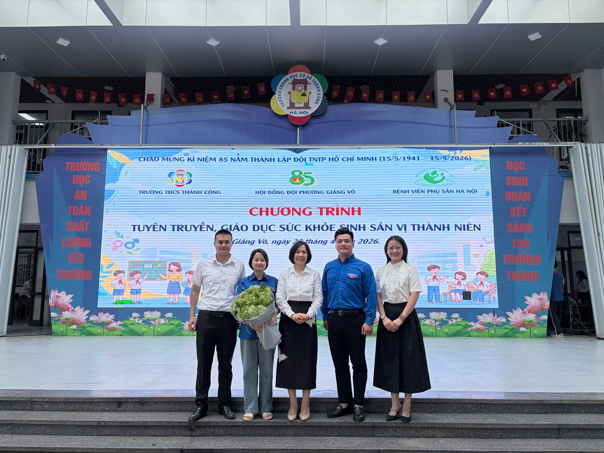A group of people standing on steps in front of a sign

AI-generated content may be incorrect.