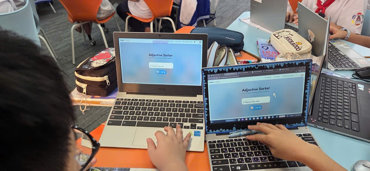 A pair of hands on a computer

Description automatically generated