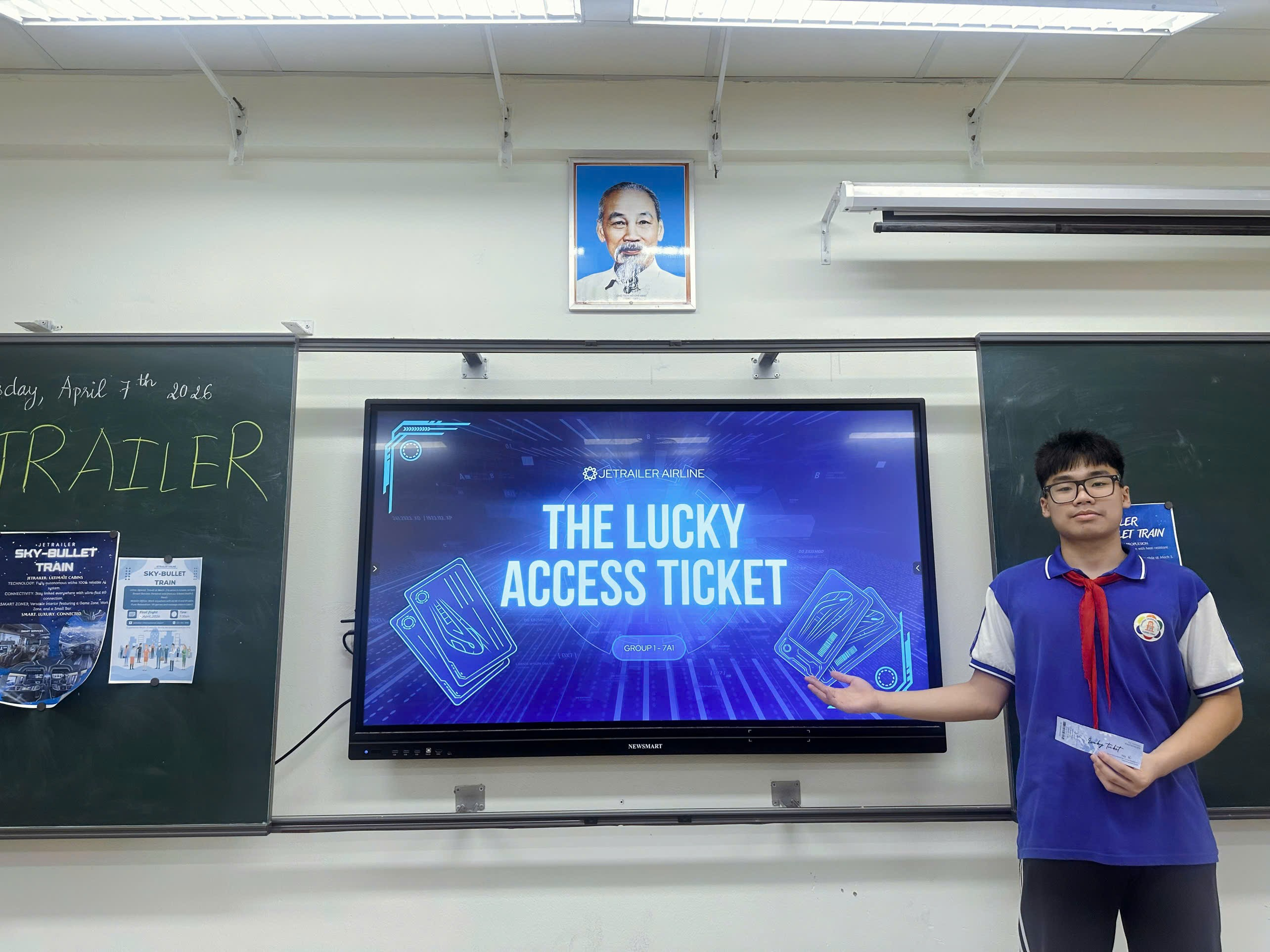 A person standing in front of a large screen
Description automatically generated