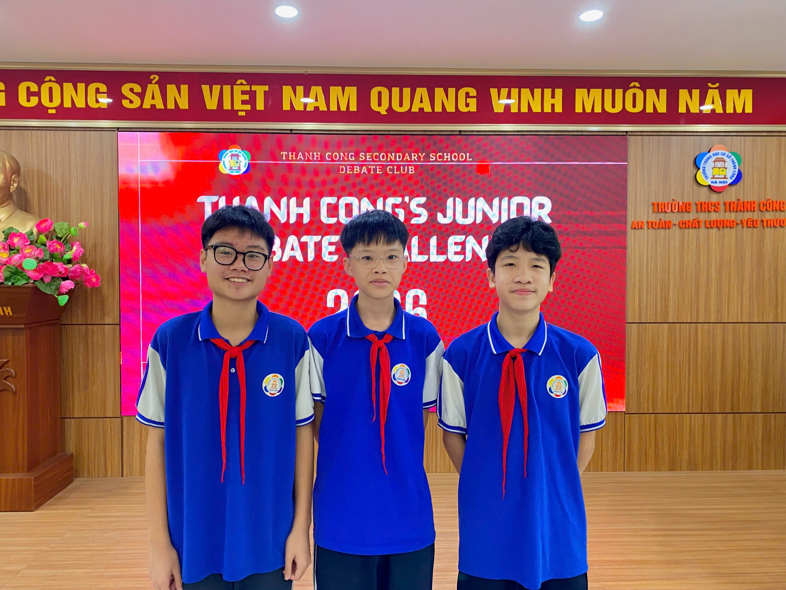 A group of boys in blue uniforms

Description automatically generated