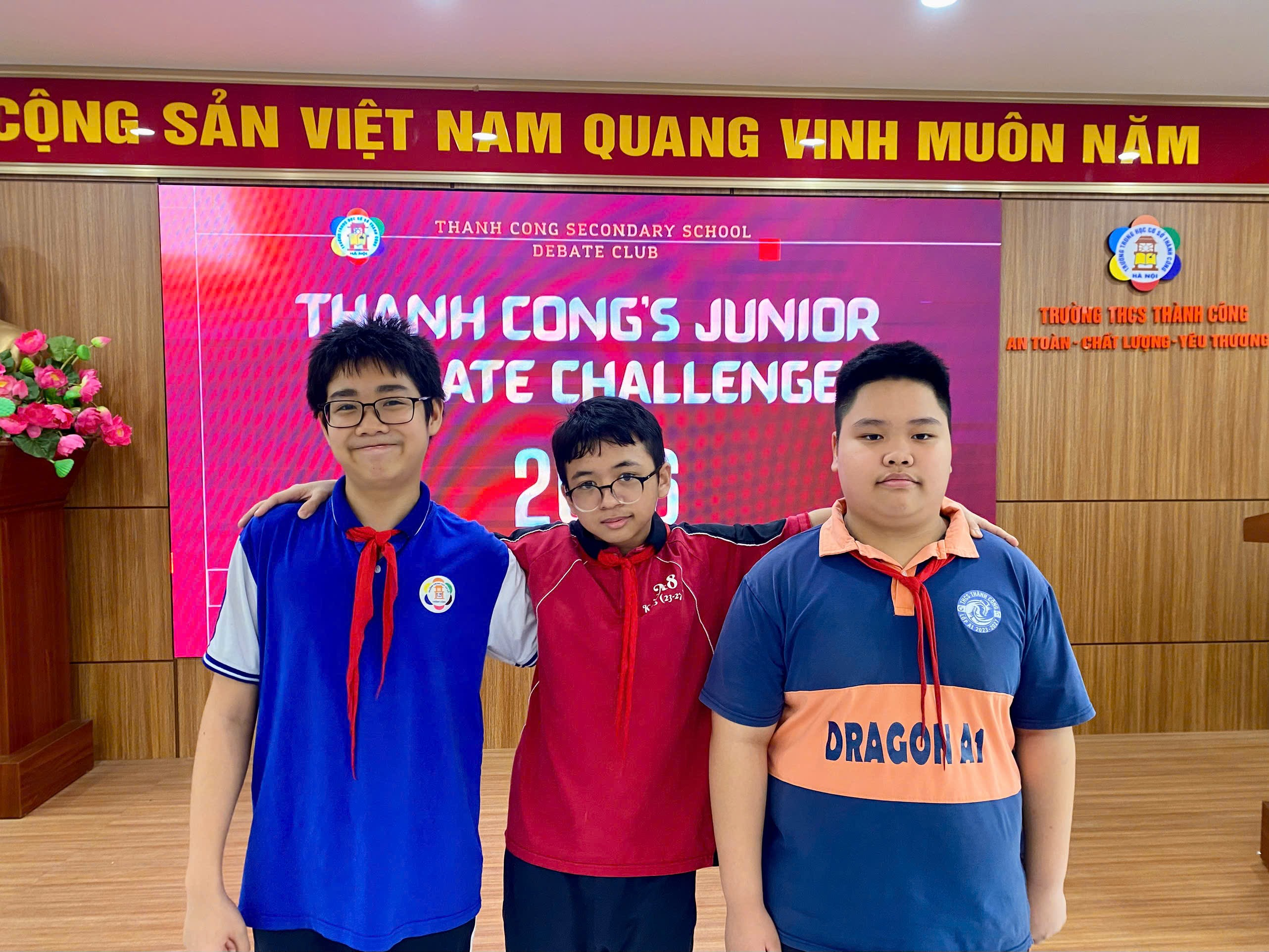 A group of boys standing in a room

Description automatically generated